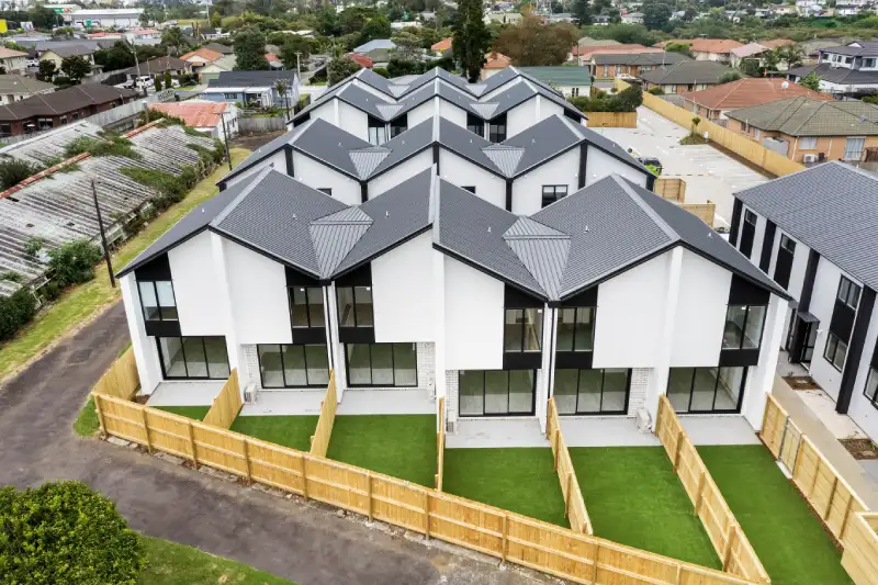 Subdivision site in Auckland with open ground and boundary markers